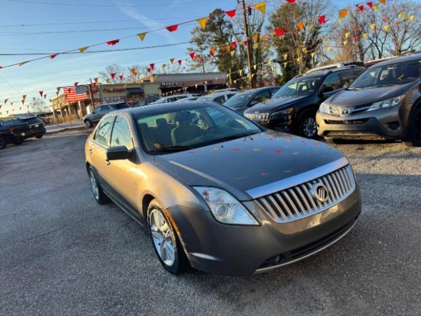 2010 Gray Mercury Milan I4 (3MEHM0HA1AR) with an 2.5L L4 DOHC 16V engine, 5-Speed Automatic transmission, located at 1806 Veterans Memorial Hwy SW, Austell, GA, 30168, (770) 944-9558, 33.817959, -84.606987 - Photo#2