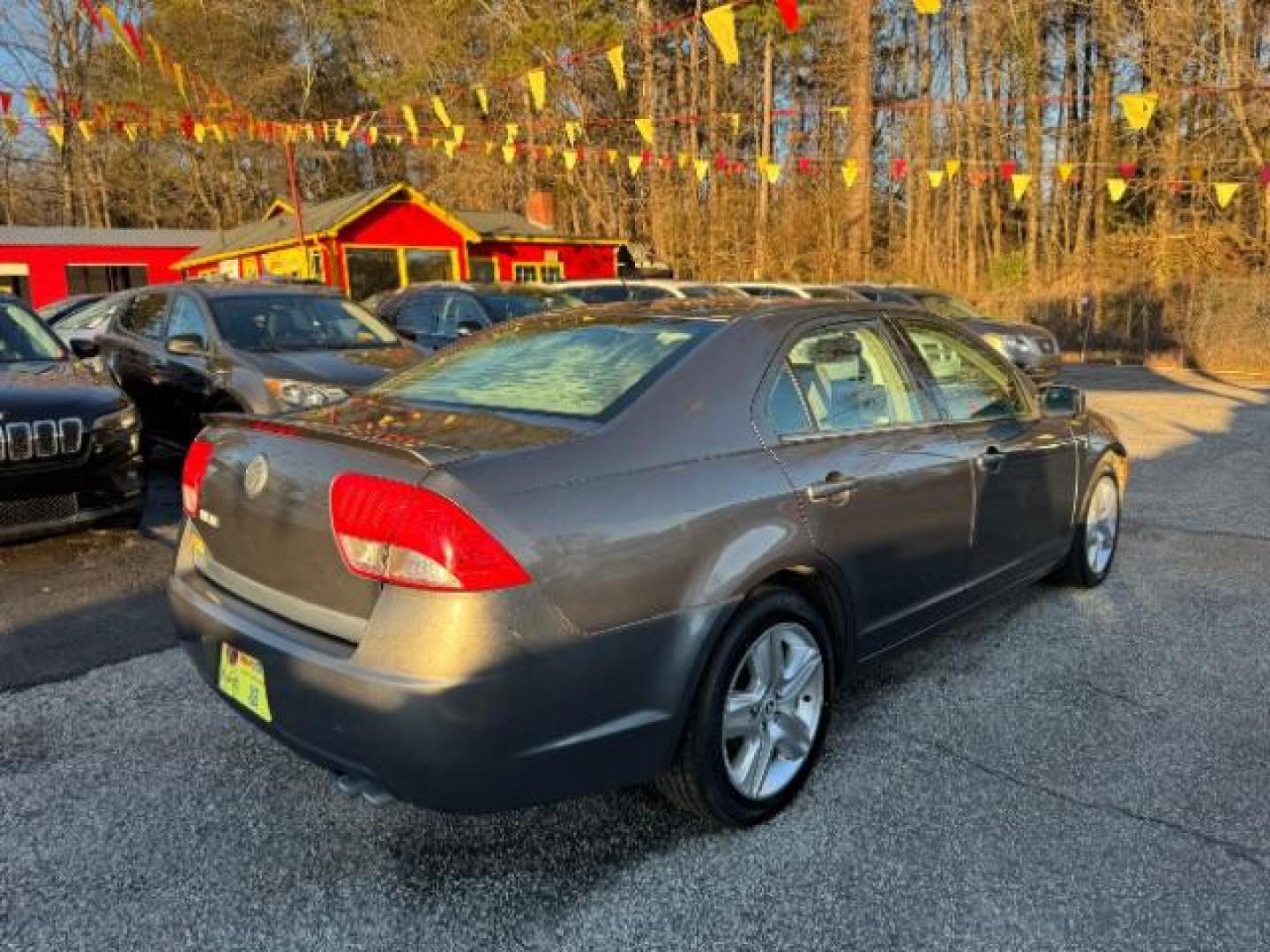 2010 Gray Mercury Milan I4 (3MEHM0HA1AR) with an 2.5L L4 DOHC 16V engine, 5-Speed Automatic transmission, located at 1806 Veterans Memorial Hwy SW, Austell, GA, 30168, (770) 944-9558, 33.817959, -84.606987 - Photo#3