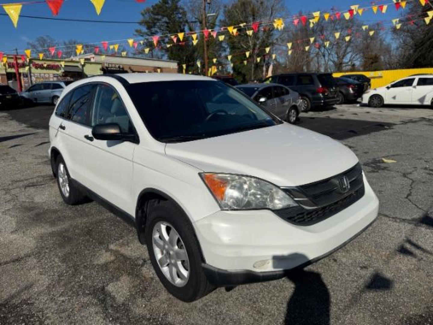 2011 White Honda CR-V SE 2WD 5-Speed AT (5J6RE3H45BL) with an 2.4L L4 DOHC 16V engine, 5-Speed Automatic transmission, located at 1806 Veterans Memorial Hwy SW, Austell, GA, 30168, (770) 944-9558, 33.817959, -84.606987 - Photo#2