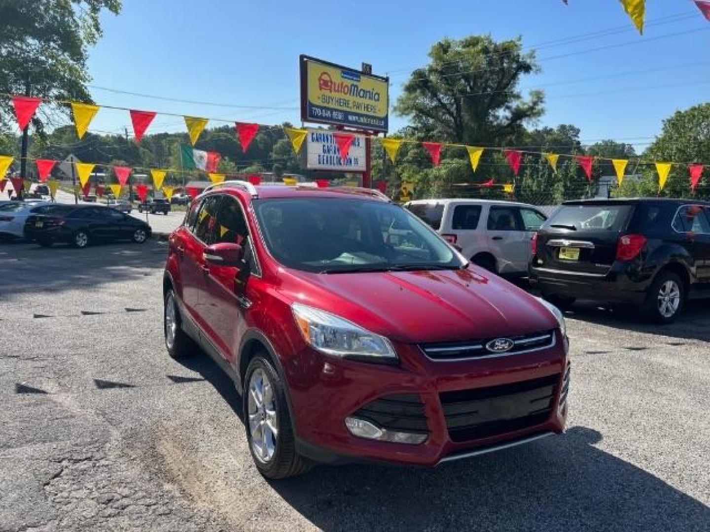 2014 Red Ford Escape SPORT UTILITY 4-DR (1FMCU0JXXEU) with an 1.6L L4 DOHC 16V engine, 6-Speed Automatic transmission, located at 1806 Veterans Memorial Hwy SW, Austell, GA, 30168, (770) 944-9558, 33.817959, -84.606987 - Photo#0
