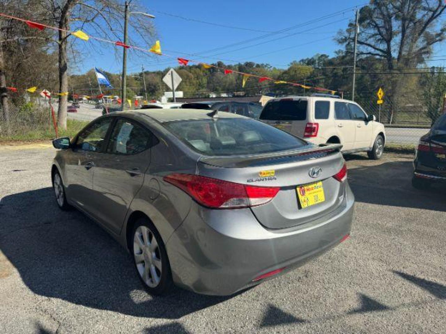 2013 Silver Hyundai Elantra Limited (KMHDH4AE4DU) with an 1.8L L4 DOHC 16V engine, 6-Speed Automatic transmission, located at 1806 Veterans Memorial Hwy SW, Austell, GA, 30168, (770) 944-9558, 33.817959, -84.606987 - Photo#5