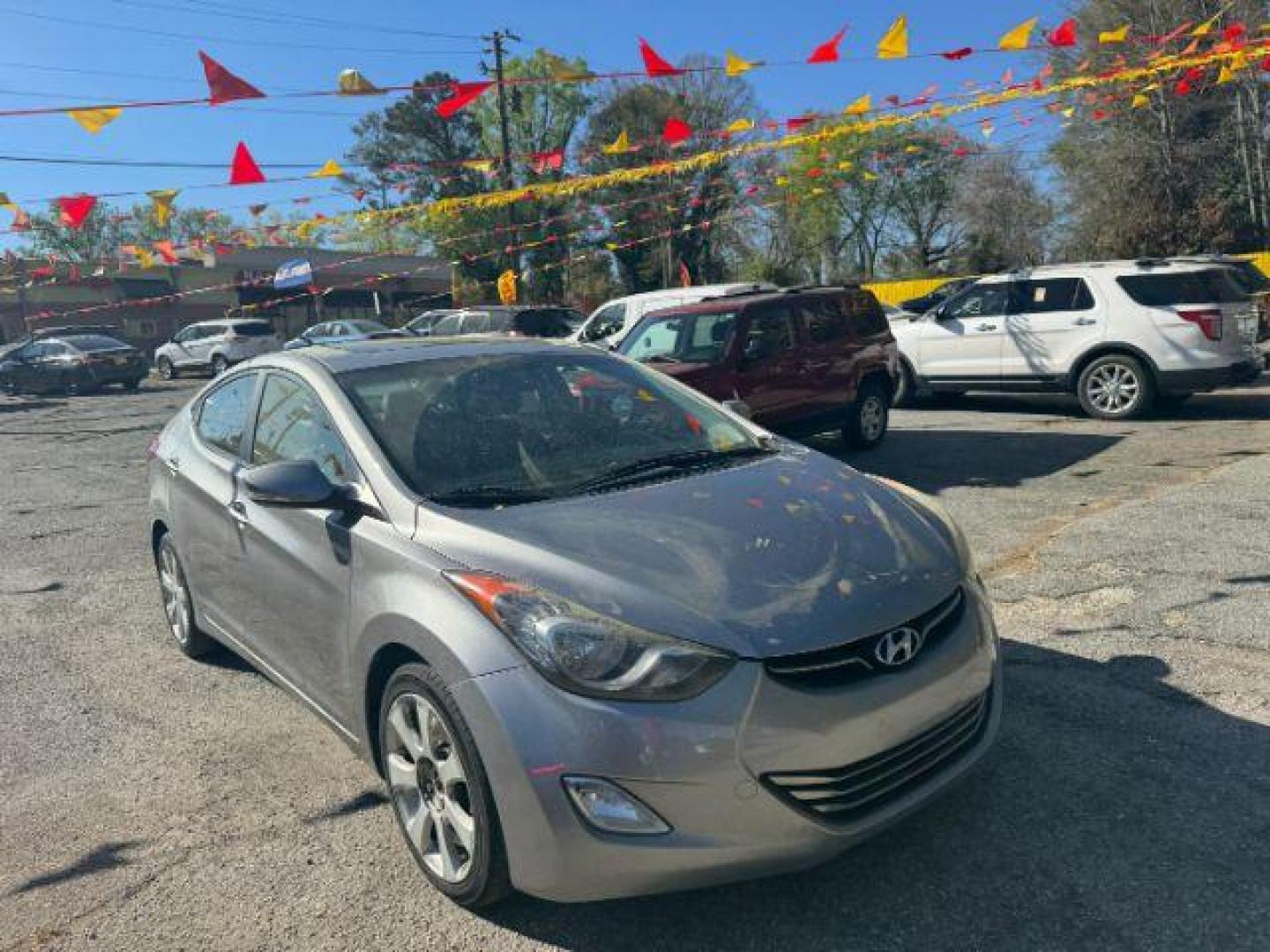 2013 Silver Hyundai Elantra Limited (KMHDH4AE4DU) with an 1.8L L4 DOHC 16V engine, 6-Speed Automatic transmission, located at 1806 Veterans Memorial Hwy SW, Austell, GA, 30168, (770) 944-9558, 33.817959, -84.606987 - Photo#2