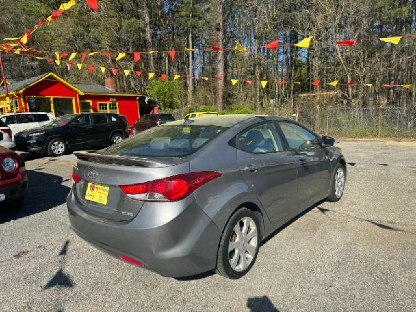 2013 Silver Hyundai Elantra Limited (KMHDH4AE4DU) with an 1.8L L4 DOHC 16V engine, 6-Speed Automatic transmission, located at 1806 Veterans Memorial Hwy SW, Austell, GA, 30168, (770) 944-9558, 33.817959, -84.606987 - Photo#3