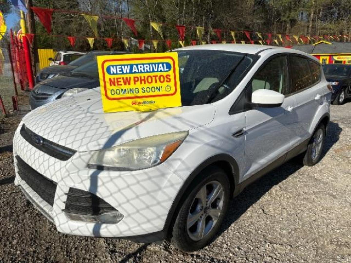 2015 White Ford Escape SE FWD (1FMCU0GX0FU) with an 1.6L L4 DOHC 16V engine, 6-Speed Automatic transmission, located at 1806 Veterans Memorial Hwy SW, Austell, GA, 30168, (770) 944-9558, 33.817959, -84.606987 - Photo#0