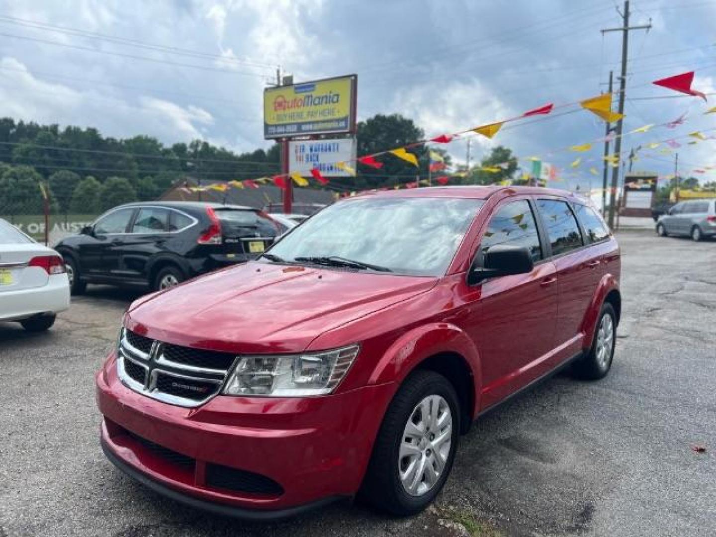 2015 Red Dodge Journey SE (3C4PDCAB5FT) with an 2.4L L4 DOHC 16V engine, 4-Speed Automatic transmission, located at 1806 Veterans Memorial Hwy SW, Austell, GA, 30168, (770) 944-9558, 33.817959, -84.606987 - Photo#2