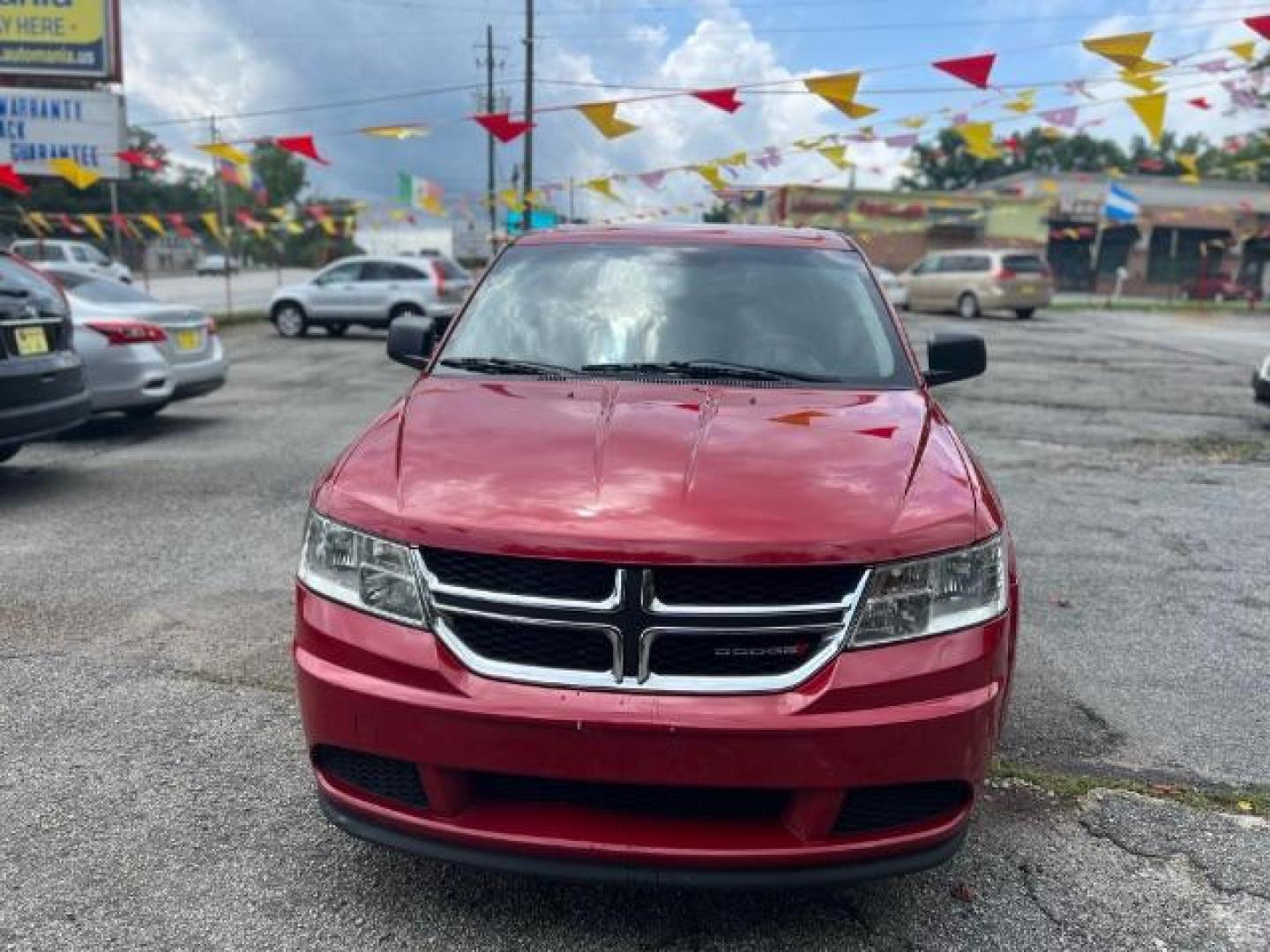 2015 Red Dodge Journey SE (3C4PDCAB5FT) with an 2.4L L4 DOHC 16V engine, 4-Speed Automatic transmission, located at 1806 Veterans Memorial Hwy SW, Austell, GA, 30168, (770) 944-9558, 33.817959, -84.606987 - Photo#3