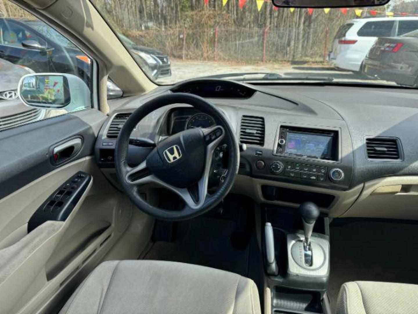 2011 White Honda Civic LX Sedan 5-Speed AT (19XFA1F55BE) with an 1.8L L4 SOHC 16V engine, 5-Speed Automatic transmission, located at 1806 Veterans Memorial Hwy SW, Austell, GA, 30168, (770) 944-9558, 33.817959, -84.606987 - Photo#12