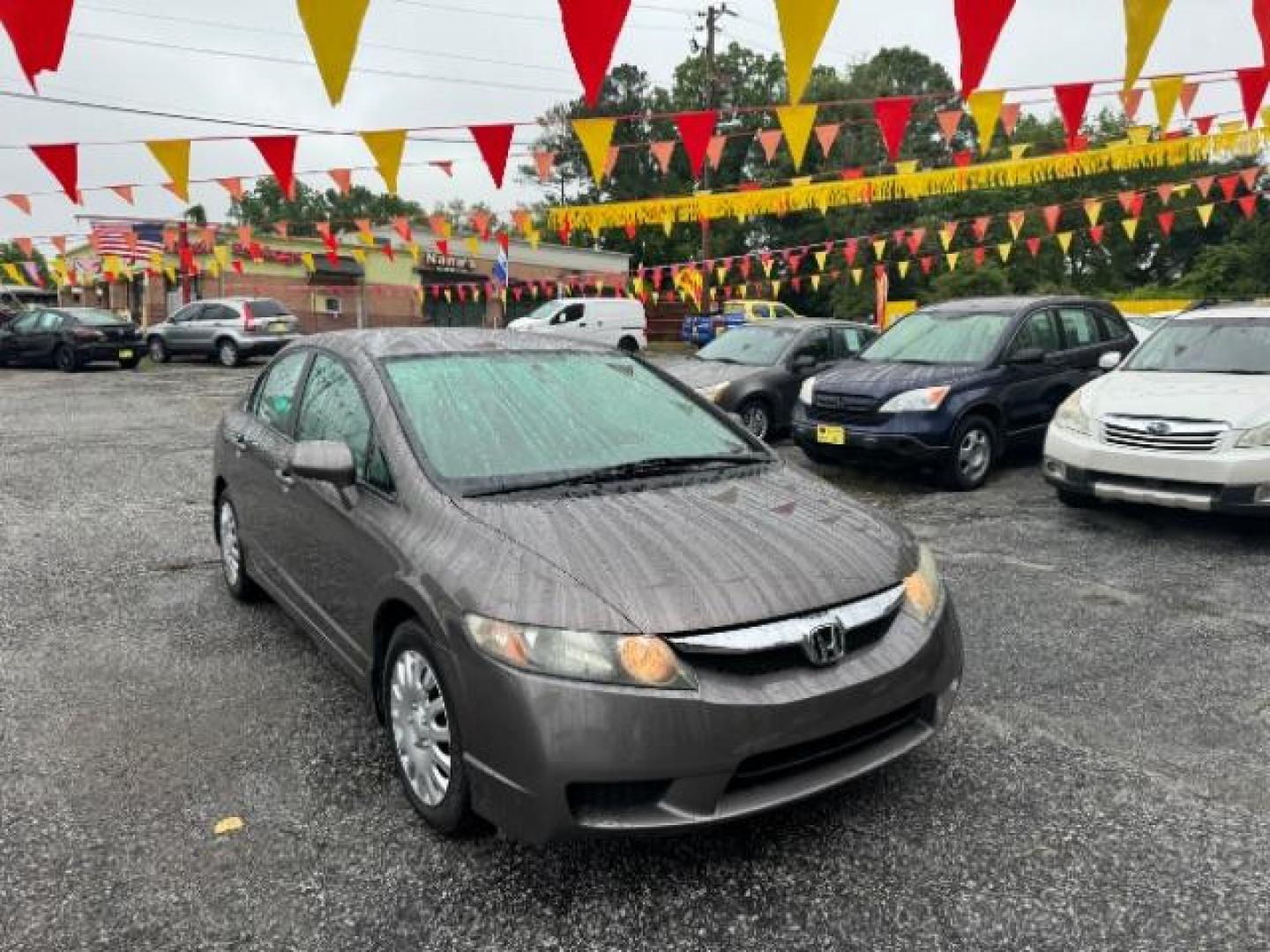 2011 Gray Honda Civic LX Sedan 5-Speed AT (19XFA1F52BE) with an 1.8L L4 SOHC 16V engine, 5-Speed Automatic transmission, located at 1806 Veterans Memorial Hwy SW, Austell, GA, 30168, (770) 944-9558, 33.817959, -84.606987 - Photo#2