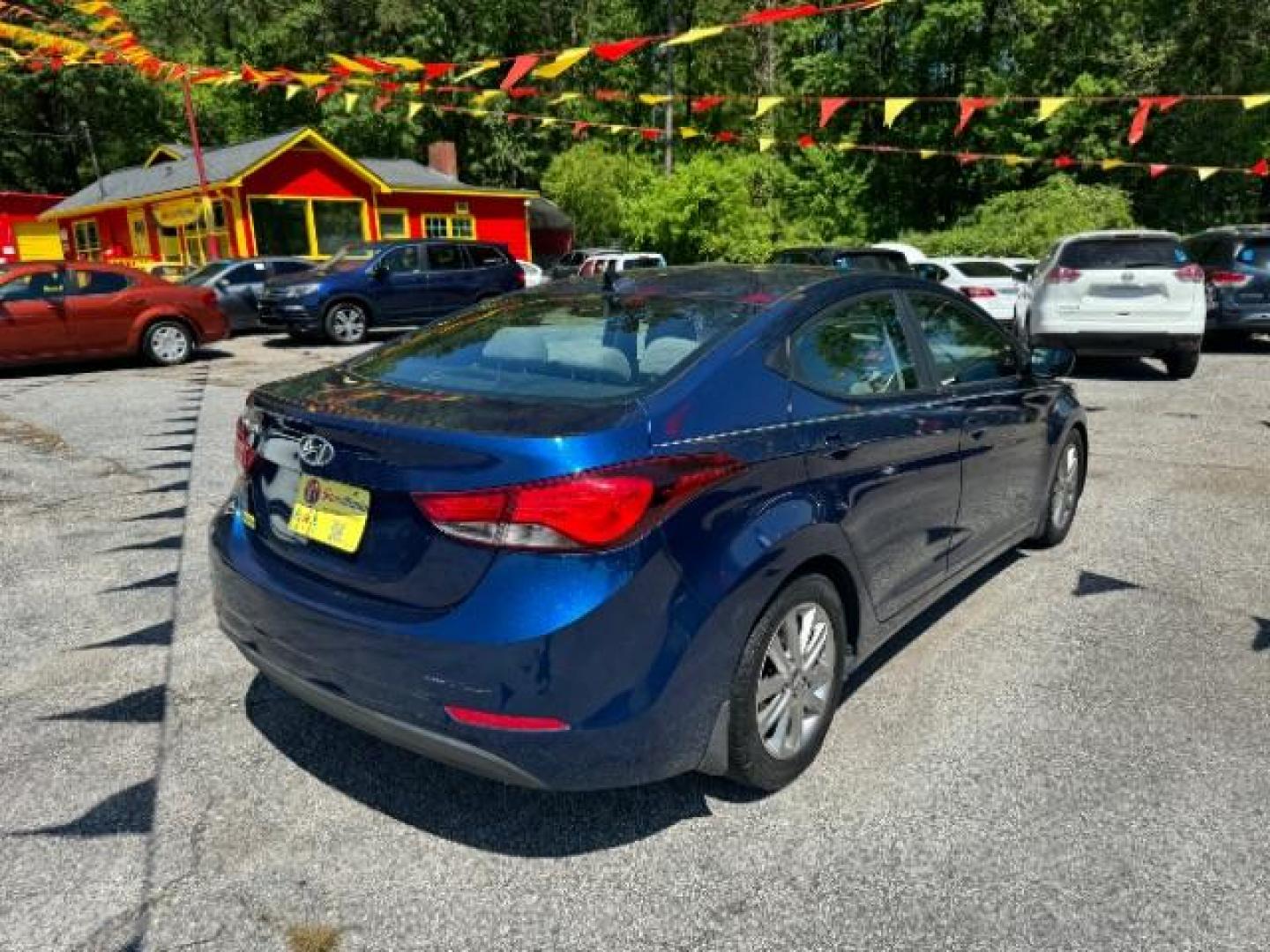 2015 Blue Hyundai Elantra SE 6AT (5NPDH4AE7FH) with an 1.8L L4 DOHC 16V engine, 6-Speed Automatic transmission, located at 1806 Veterans Memorial Hwy SW, Austell, GA, 30168, (770) 944-9558, 33.817959, -84.606987 - Photo#3