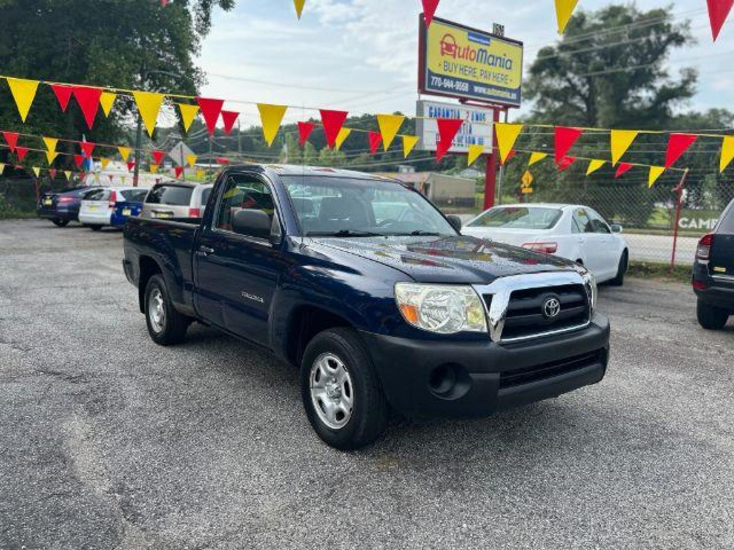 2006 Blue Toyota Tacoma Regular Cab 2WD (5TENX22N36Z) with an 2.7L L4 DOHC 16V engine, 5-Speed Manual transmission, located at 1806 Veterans Memorial Hwy SW, Austell, GA, 30168, (770) 944-9558, 33.817959, -84.606987 - Photo#2