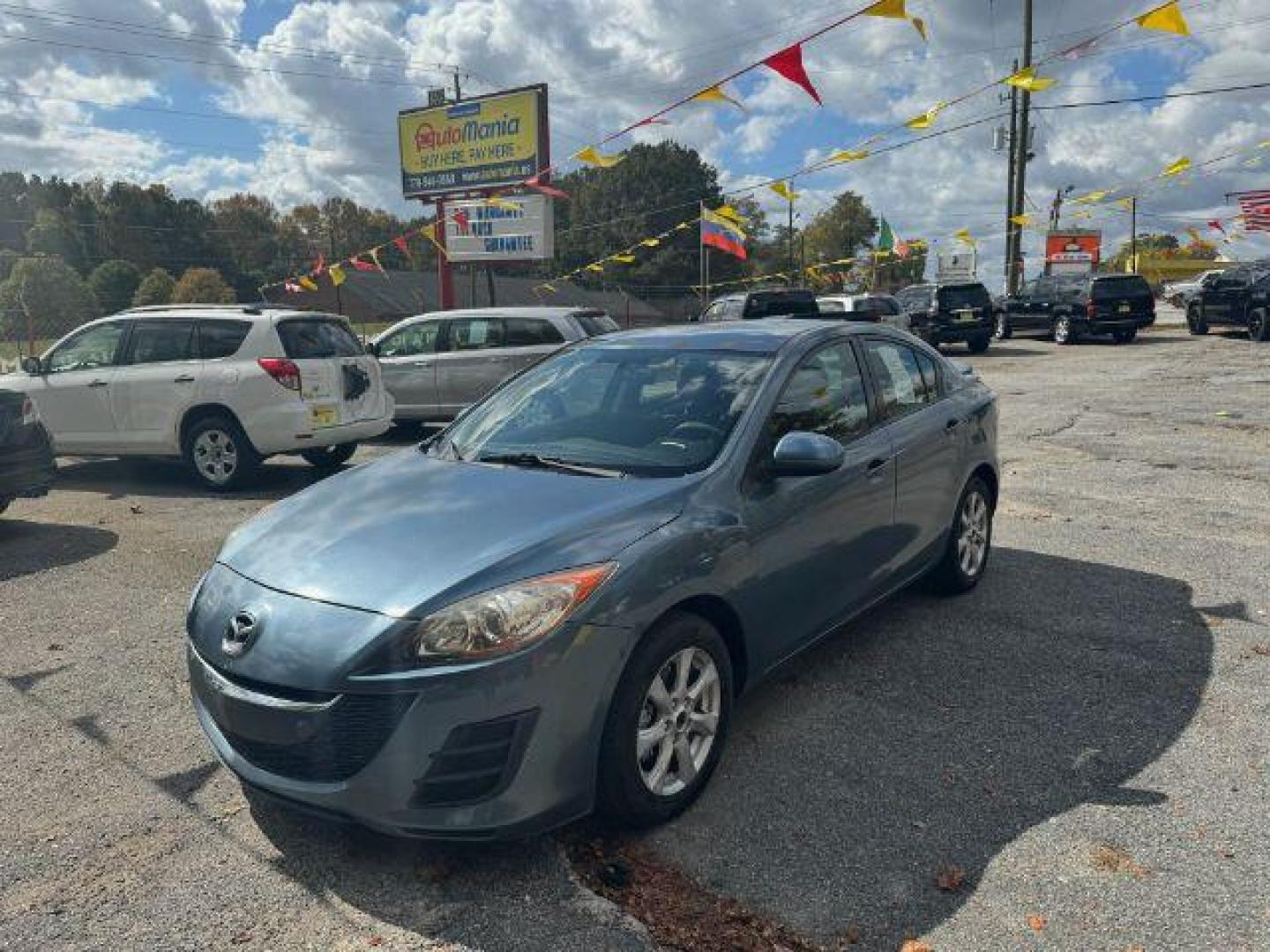 2010 Blue Mazda MAZDA3 i Sport 4-Door (JM1BL1SF0A1) with an 2.0L L4 DOHC 16V engine, 5-Speed Automatic transmission, located at 1806 Veterans Memorial Hwy SW, Austell, GA, 30168, (770) 944-9558, 33.817959, -84.606987 - Photo#0