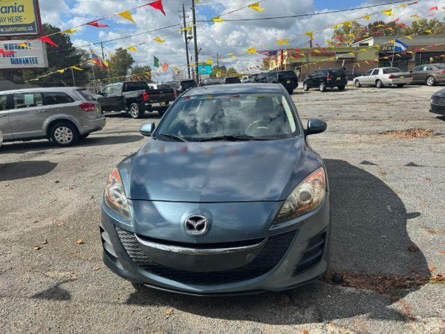 2010 Blue Mazda MAZDA3 i Sport 4-Door (JM1BL1SF0A1) with an 2.0L L4 DOHC 16V engine, 5-Speed Automatic transmission, located at 1806 Veterans Memorial Hwy SW, Austell, GA, 30168, (770) 944-9558, 33.817959, -84.606987 - Photo#1