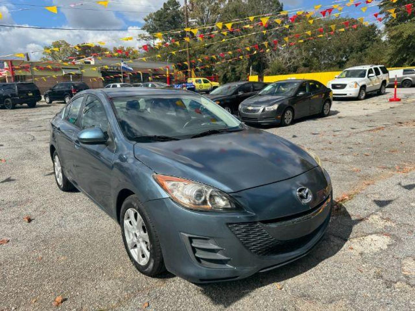 2010 Blue Mazda MAZDA3 i Sport 4-Door (JM1BL1SF0A1) with an 2.0L L4 DOHC 16V engine, 5-Speed Automatic transmission, located at 1806 Veterans Memorial Hwy SW, Austell, GA, 30168, (770) 944-9558, 33.817959, -84.606987 - Photo#2