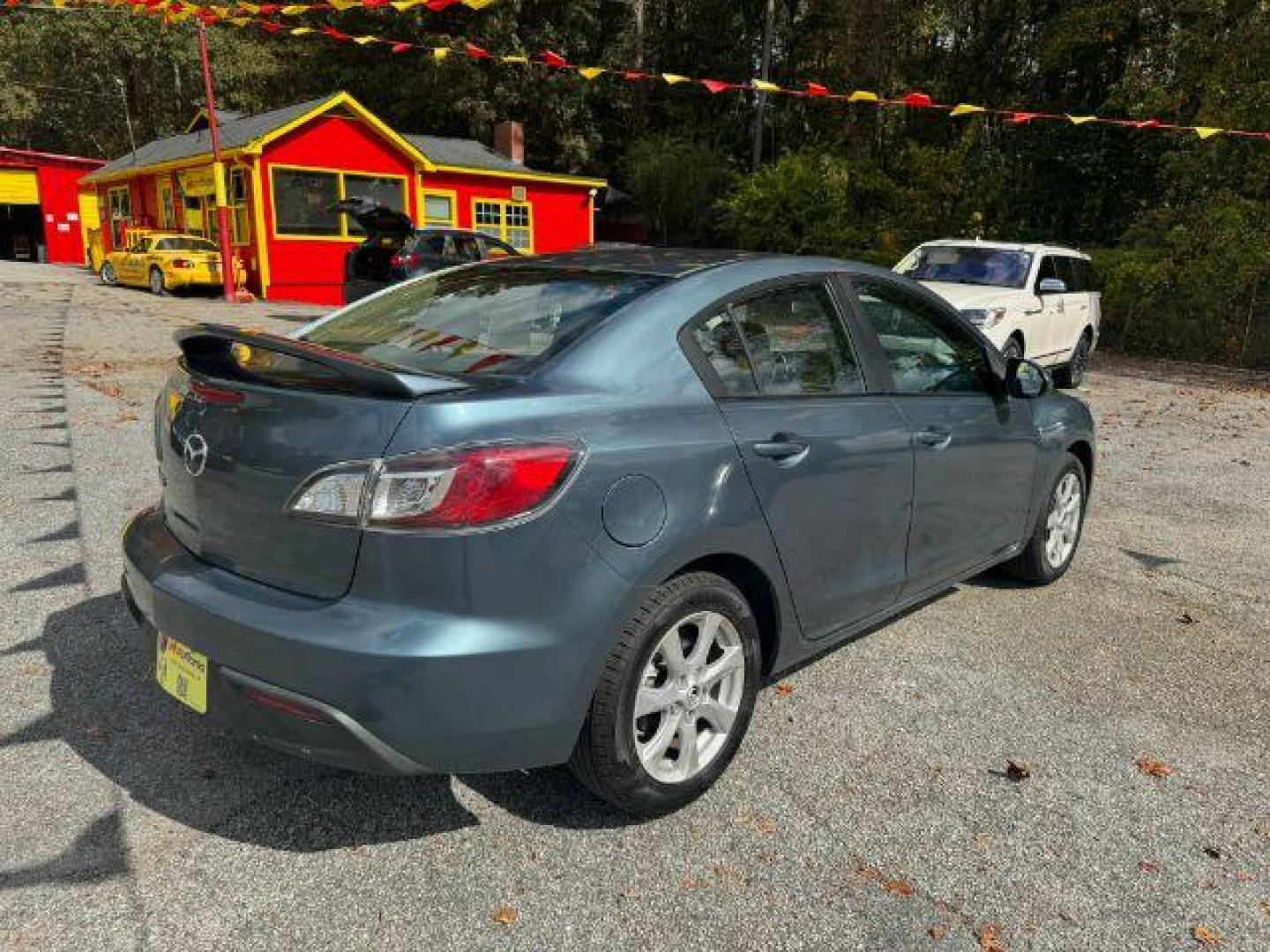 2010 Blue Mazda MAZDA3 i Sport 4-Door (JM1BL1SF0A1) with an 2.0L L4 DOHC 16V engine, 5-Speed Automatic transmission, located at 1806 Veterans Memorial Hwy SW, Austell, GA, 30168, (770) 944-9558, 33.817959, -84.606987 - Photo#3