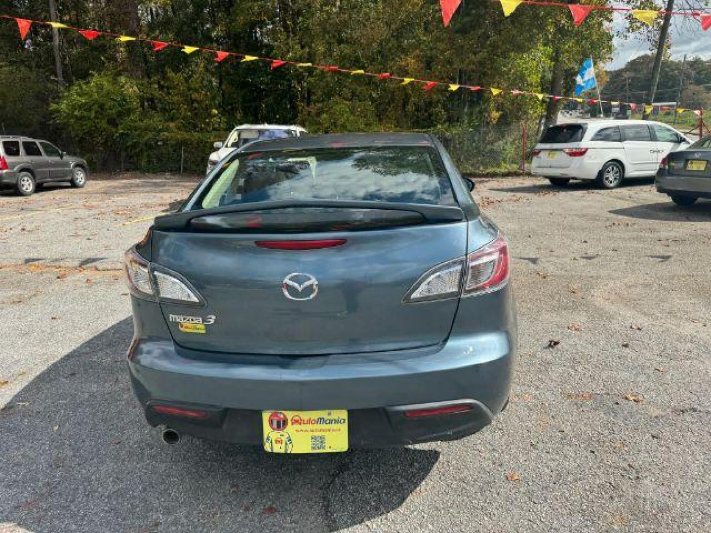 2010 Blue Mazda MAZDA3 i Sport 4-Door (JM1BL1SF0A1) with an 2.0L L4 DOHC 16V engine, 5-Speed Automatic transmission, located at 1806 Veterans Memorial Hwy SW, Austell, GA, 30168, (770) 944-9558, 33.817959, -84.606987 - Photo#4