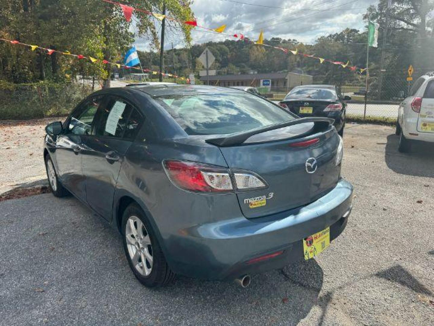 2010 Blue Mazda MAZDA3 i Sport 4-Door (JM1BL1SF0A1) with an 2.0L L4 DOHC 16V engine, 5-Speed Automatic transmission, located at 1806 Veterans Memorial Hwy SW, Austell, GA, 30168, (770) 944-9558, 33.817959, -84.606987 - Photo#5