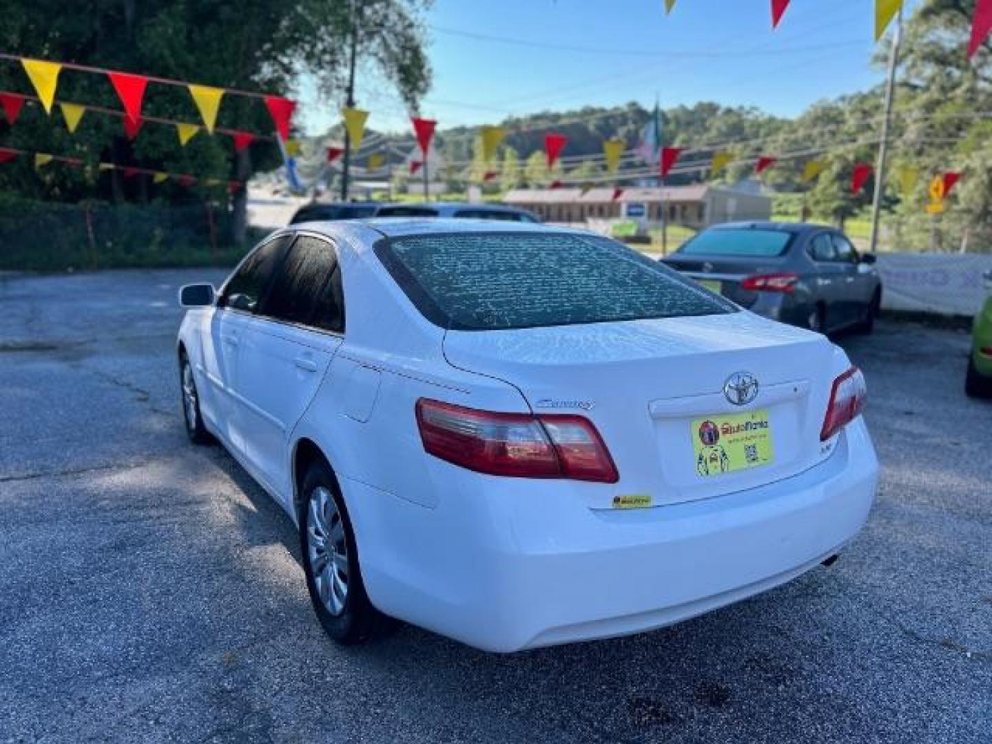 2009 White Toyota Camry LE 5-Spd AT (4T1BE46KX9U) with an 2.4L L4 DOHC 16V engine, 5-Speed Automatic transmission, located at 1806 Veterans Memorial Hwy SW, Austell, GA, 30168, (770) 944-9558, 33.817959, -84.606987 - Photo#5