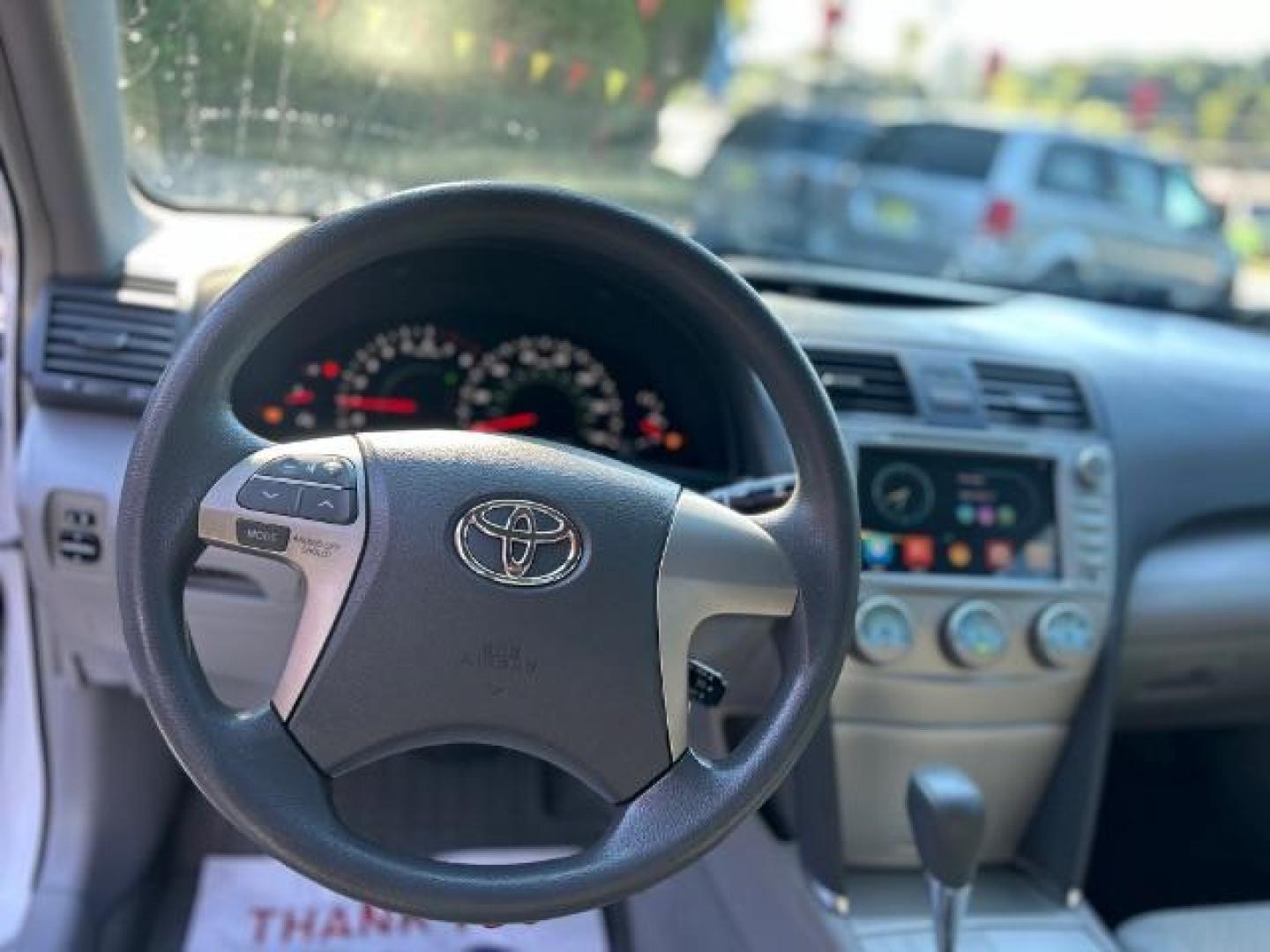 2009 White Toyota Camry LE 5-Spd AT (4T1BE46KX9U) with an 2.4L L4 DOHC 16V engine, 5-Speed Automatic transmission, located at 1806 Veterans Memorial Hwy SW, Austell, GA, 30168, (770) 944-9558, 33.817959, -84.606987 - Photo#8