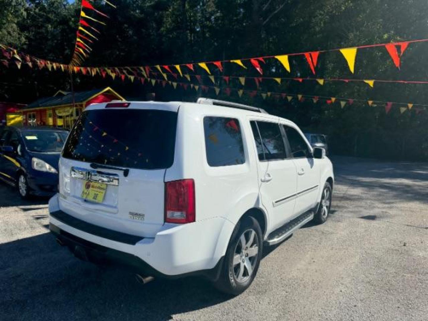 2012 White Honda Pilot Touring 4WD 5-Spd AT with DVD (5FNYF4H9XCB) with an 3.5L V6 SOHC 24V engine, 5-Speed Automatic transmission, located at 1806 Veterans Memorial Hwy SW, Austell, GA, 30168, (770) 944-9558, 33.817959, -84.606987 - Photo#3