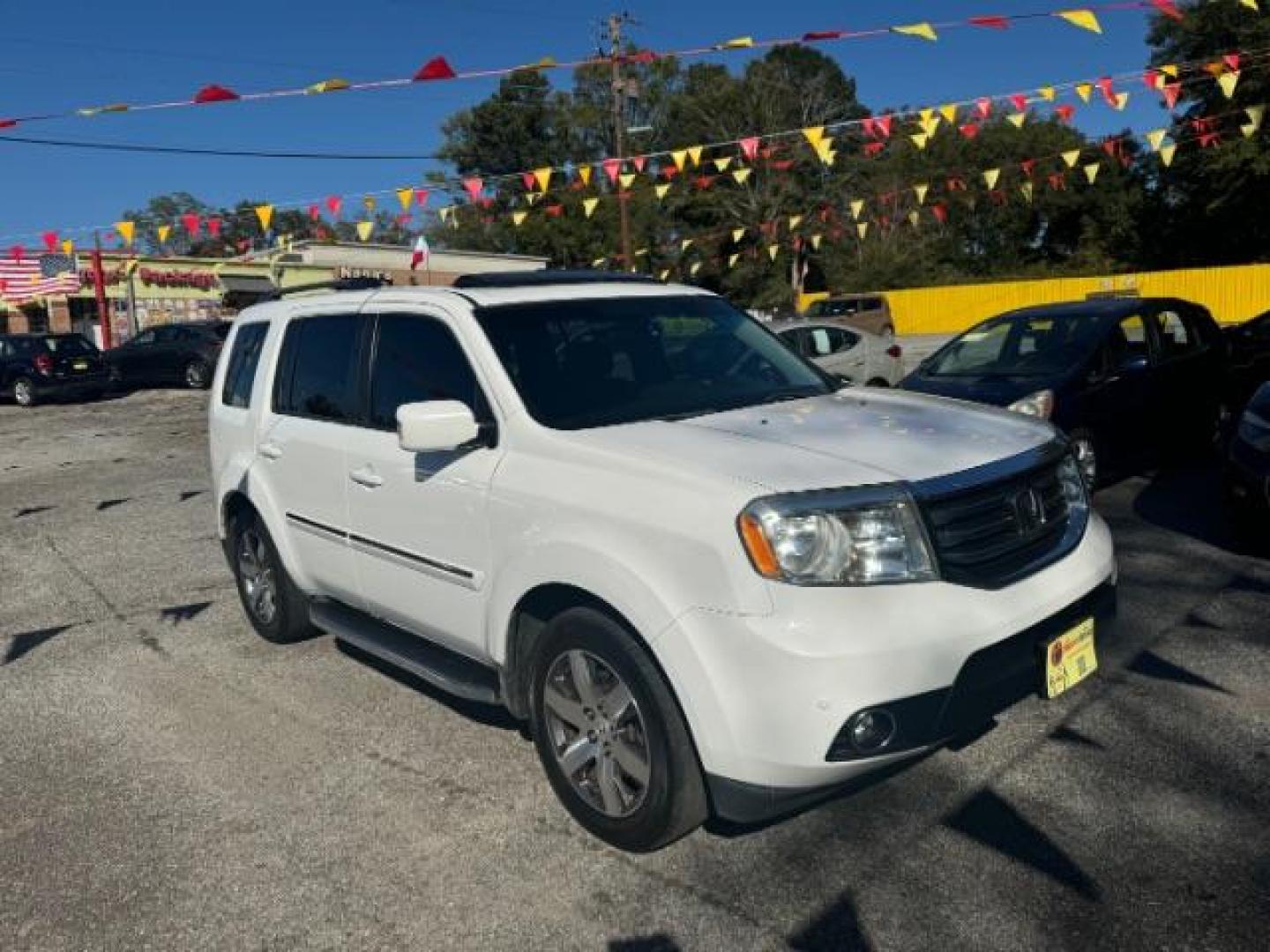 2012 White Honda Pilot Touring 4WD 5-Spd AT with DVD (5FNYF4H9XCB) with an 3.5L V6 SOHC 24V engine, 5-Speed Automatic transmission, located at 1806 Veterans Memorial Hwy SW, Austell, GA, 30168, (770) 944-9558, 33.817959, -84.606987 - Photo#2