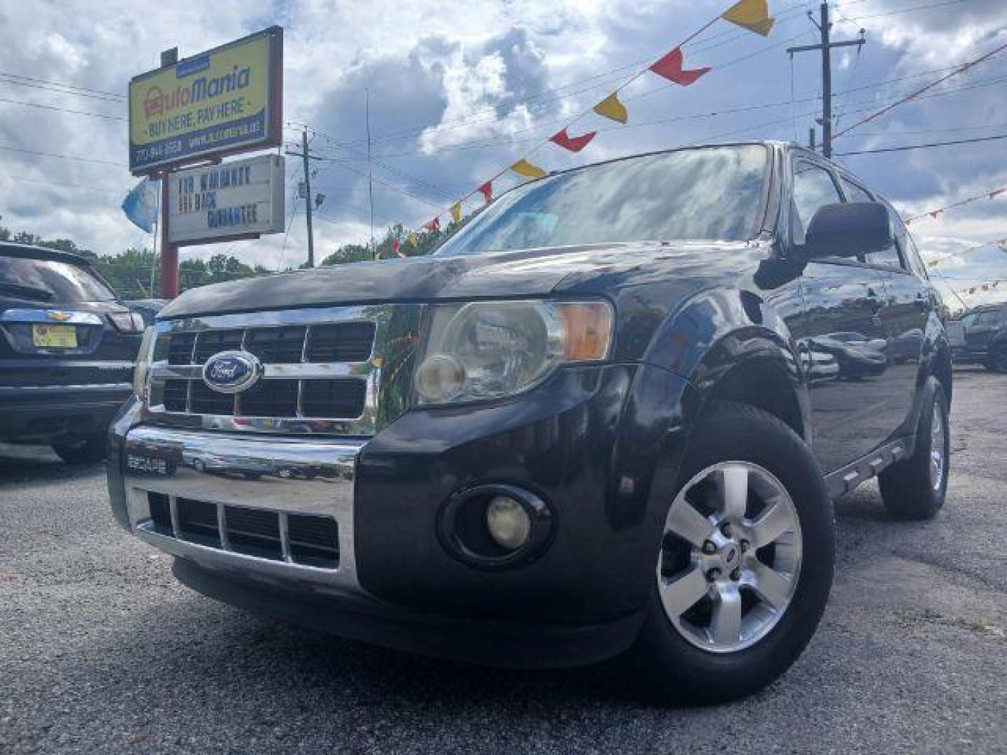 2011 Black Ford Escape Limited FWD (1FMCU0EG4BK) with an 3.0L V6 DOHC 24V engine, 6-Speed Automatic transmission, located at 1806 Veterans Memorial Hwy SW, Austell, GA, 30168, (770) 944-9558, 33.817959, -84.606987 - Photo#0