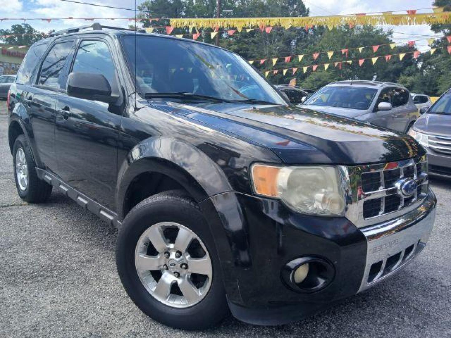 2011 Black Ford Escape Limited FWD (1FMCU0EG4BK) with an 3.0L V6 DOHC 24V engine, 6-Speed Automatic transmission, located at 1806 Veterans Memorial Hwy SW, Austell, GA, 30168, (770) 944-9558, 33.817959, -84.606987 - Photo#2