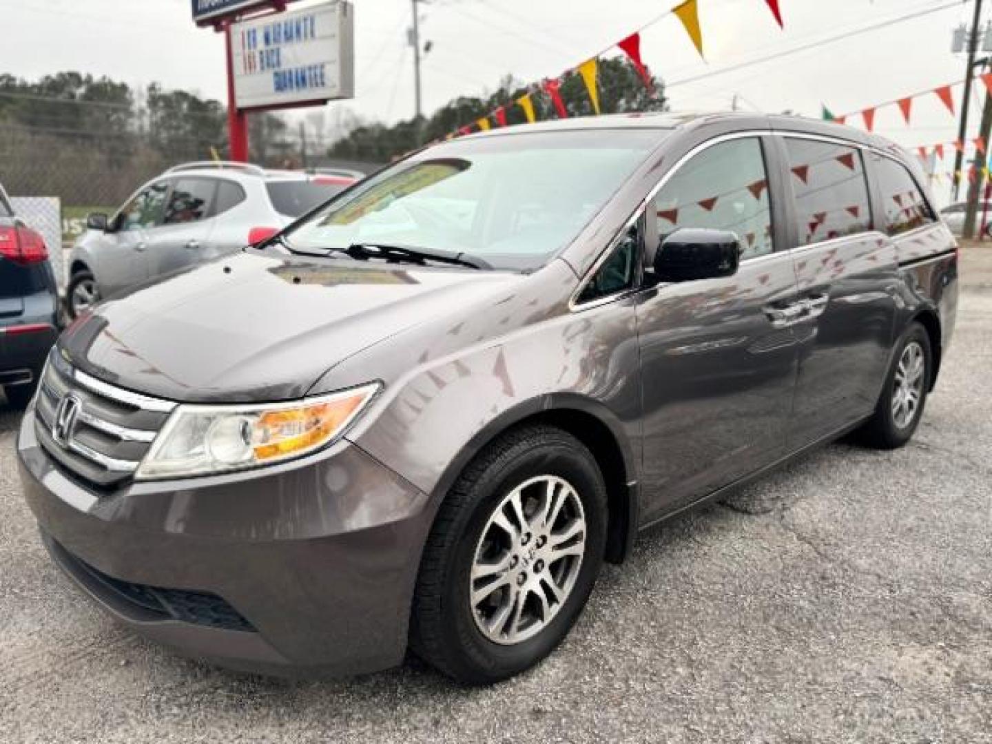 2012 Gray Honda Odyssey EX-L (5FNRL5H62CB) with an 3.5L V6 SOHC 24V engine, 5-Speed Automatic transmission, located at 1806 Veterans Memorial Hwy SW, Austell, GA, 30168, (770) 944-9558, 33.817959, -84.606987 - Photo#0