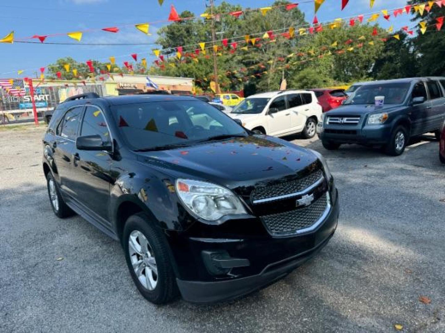 2014 Black Chevrolet Equinox 1LT 2WD (2GNALBEK9E1) with an 2.4L L4 DOHC 16V FFV engine, 6-Speed Automatic transmission, located at 1806 Veterans Memorial Hwy SW, Austell, GA, 30168, (770) 944-9558, 33.817959, -84.606987 - Photo#2