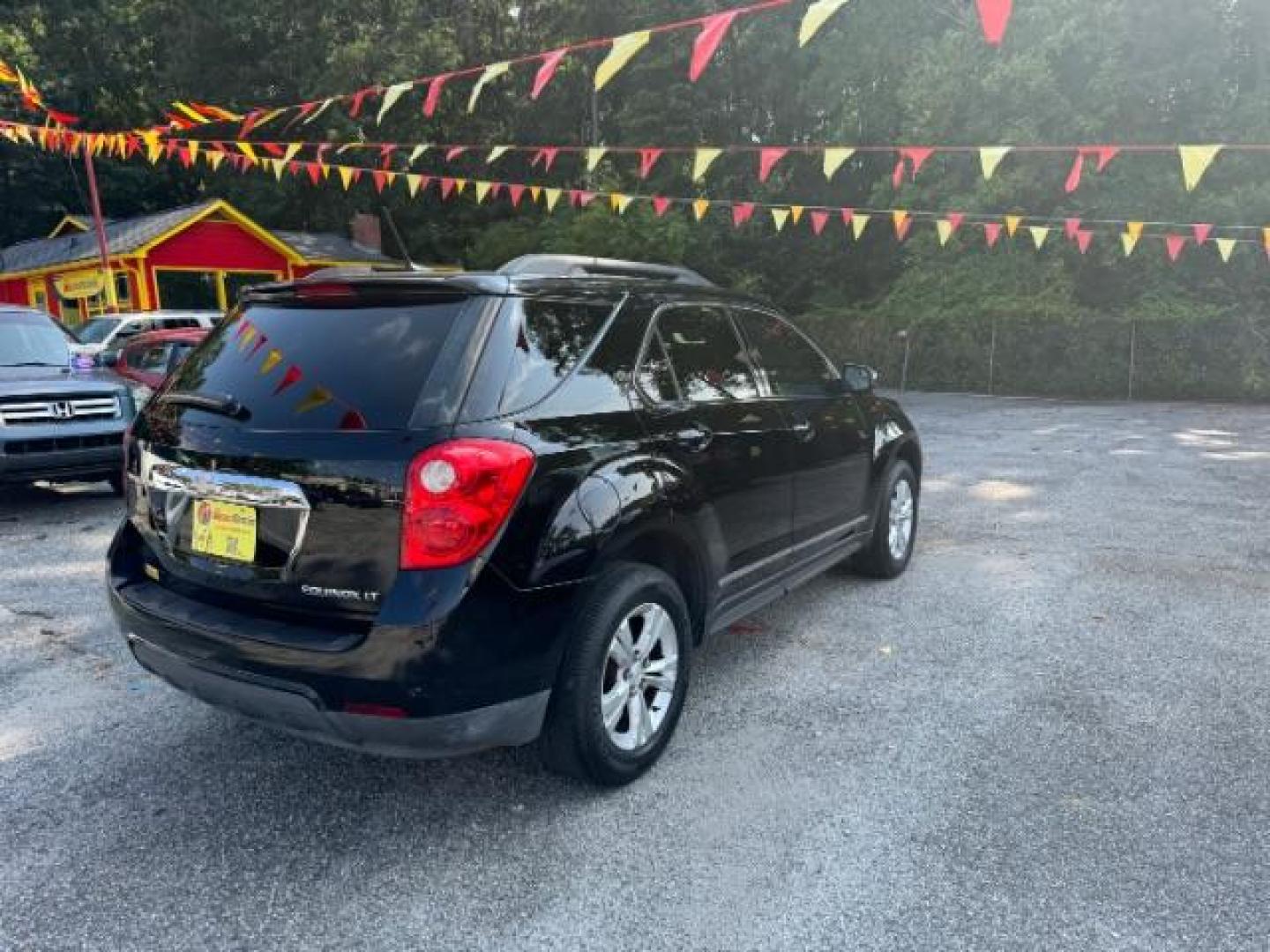 2014 Black Chevrolet Equinox 1LT 2WD (2GNALBEK9E1) with an 2.4L L4 DOHC 16V FFV engine, 6-Speed Automatic transmission, located at 1806 Veterans Memorial Hwy SW, Austell, GA, 30168, (770) 944-9558, 33.817959, -84.606987 - Photo#3