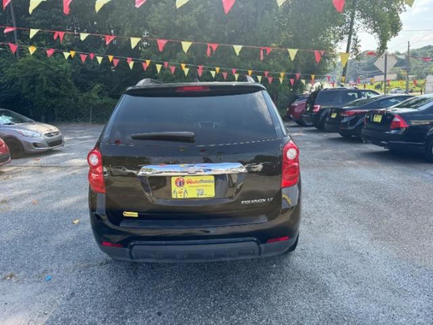 2014 Black Chevrolet Equinox 1LT 2WD (2GNALBEK9E1) with an 2.4L L4 DOHC 16V FFV engine, 6-Speed Automatic transmission, located at 1806 Veterans Memorial Hwy SW, Austell, GA, 30168, (770) 944-9558, 33.817959, -84.606987 - Photo#4