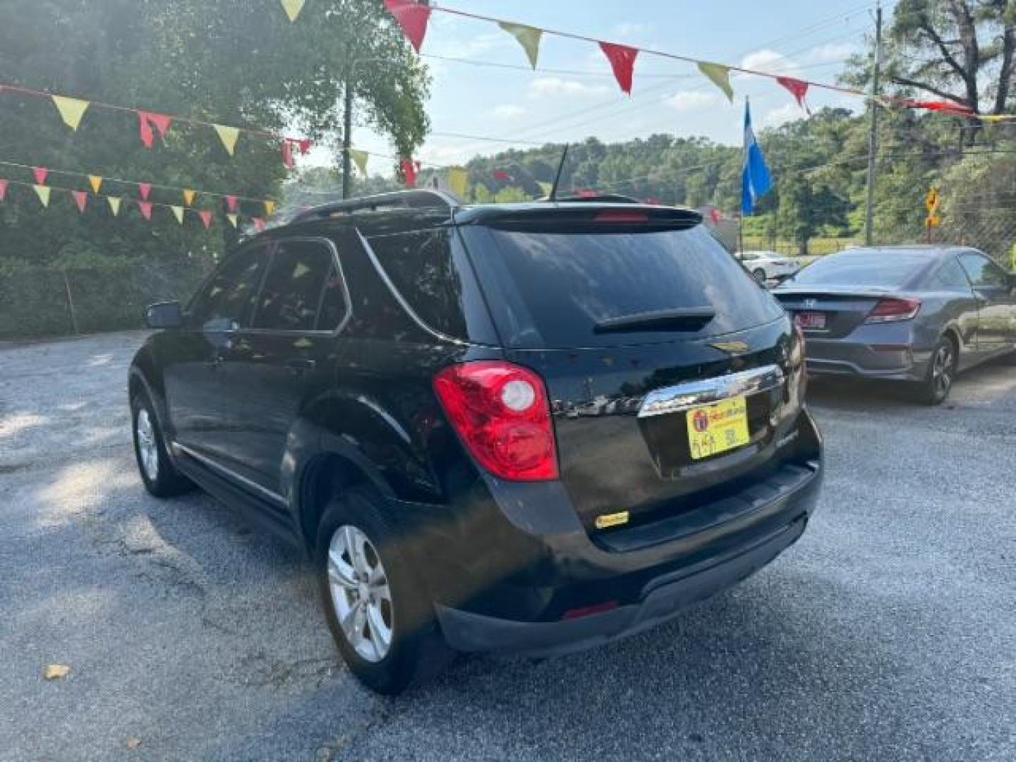 2014 Black Chevrolet Equinox 1LT 2WD (2GNALBEK9E1) with an 2.4L L4 DOHC 16V FFV engine, 6-Speed Automatic transmission, located at 1806 Veterans Memorial Hwy SW, Austell, GA, 30168, (770) 944-9558, 33.817959, -84.606987 - Photo#5