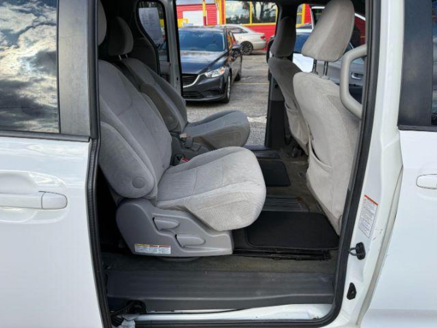 2016 White Toyota Sienna LE FWD 8-Passenger V6 (5TDKK3DC3GS) with an 3.5L V6 EFI DOHC 24V engine, 5-Speed Automatic transmission, located at 1806 Veterans Memorial Hwy SW, Austell, GA, 30168, (770) 944-9558, 33.817959, -84.606987 - Photo#19