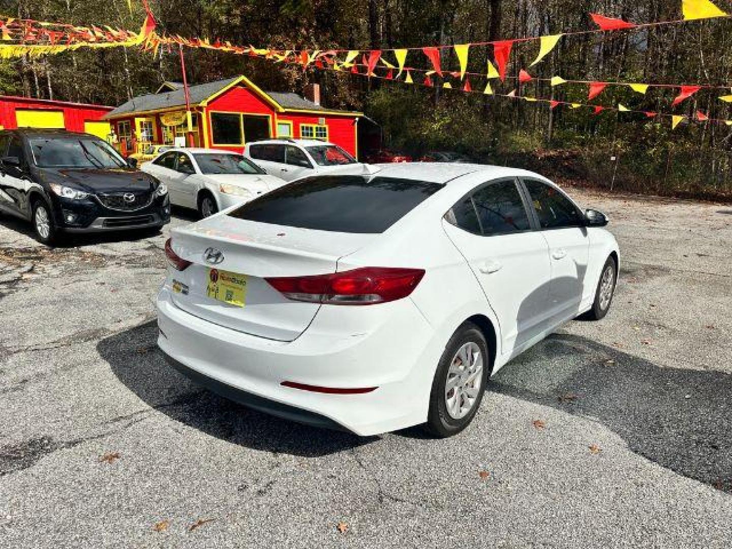 2017 White Hyundai Elantra SE 6AT (5NPD74LF5HH) with an 1.8L L4 DOHC 16V engine, 6-Speed Automatic transmission, located at 1806 Veterans Memorial Hwy SW, Austell, GA, 30168, (770) 944-9558, 33.817959, -84.606987 - Photo#2