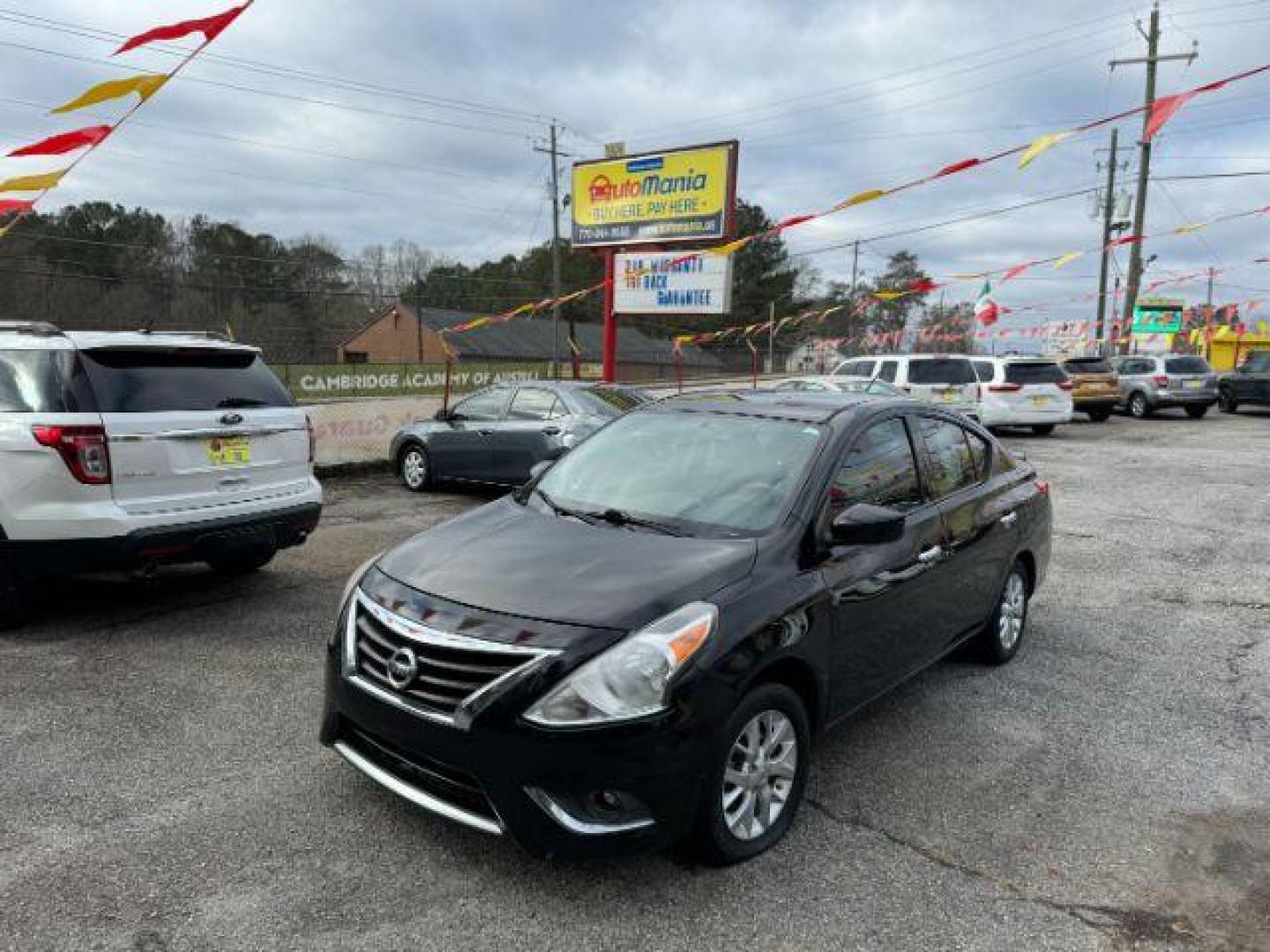 2016 Black Nissan Versa 1.6 SV Sedan (3N1CN7AP3GL) with an 1.6L L4 DOHC 16V engine, Continuously Variable Transmission transmission, located at 1806 Veterans Memorial Hwy SW, Austell, GA, 30168, (770) 944-9558, 33.817959, -84.606987 - Photo#0