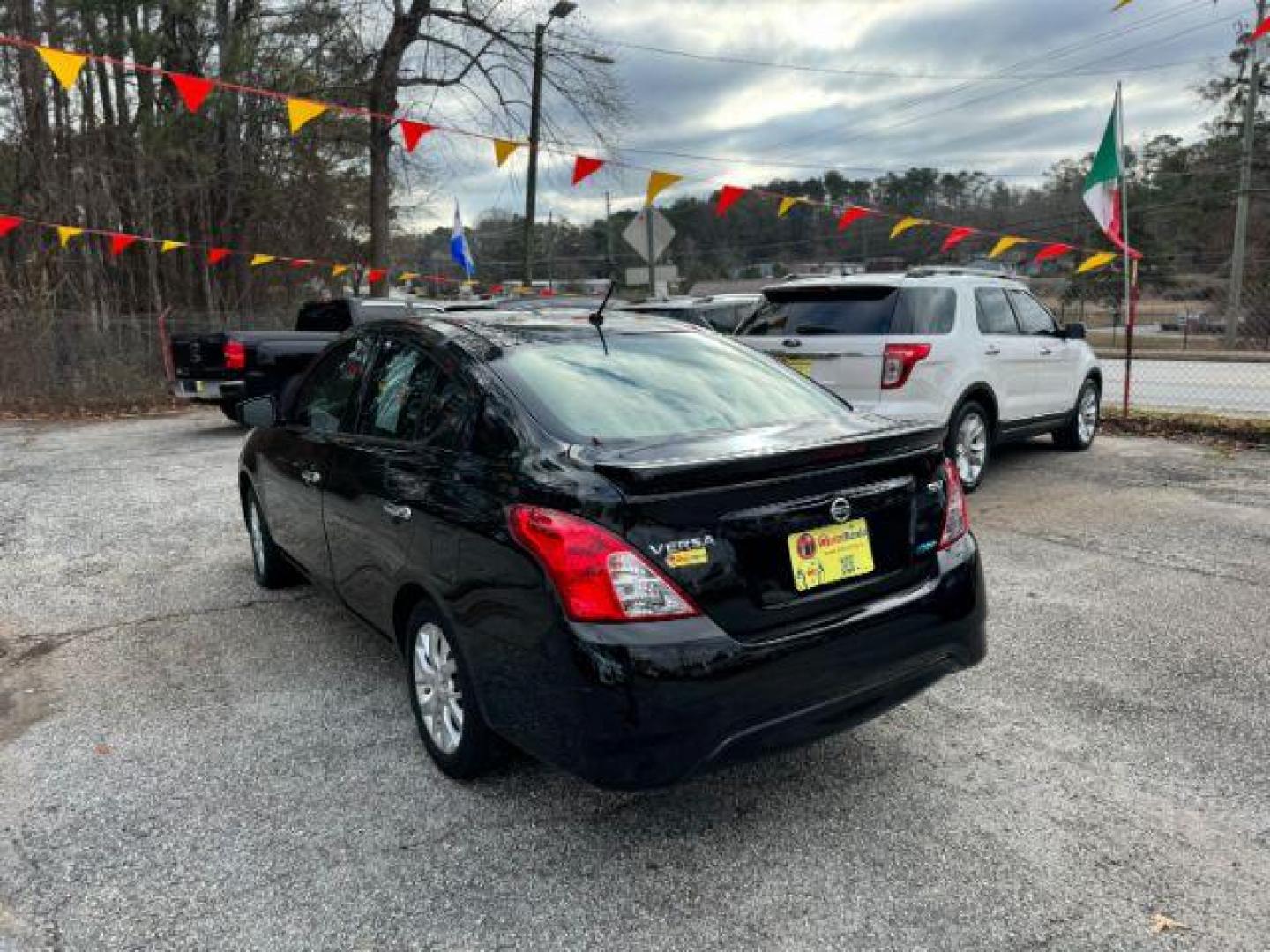 2016 Black Nissan Versa 1.6 SV Sedan (3N1CN7AP3GL) with an 1.6L L4 DOHC 16V engine, Continuously Variable Transmission transmission, located at 1806 Veterans Memorial Hwy SW, Austell, GA, 30168, (770) 944-9558, 33.817959, -84.606987 - Photo#1