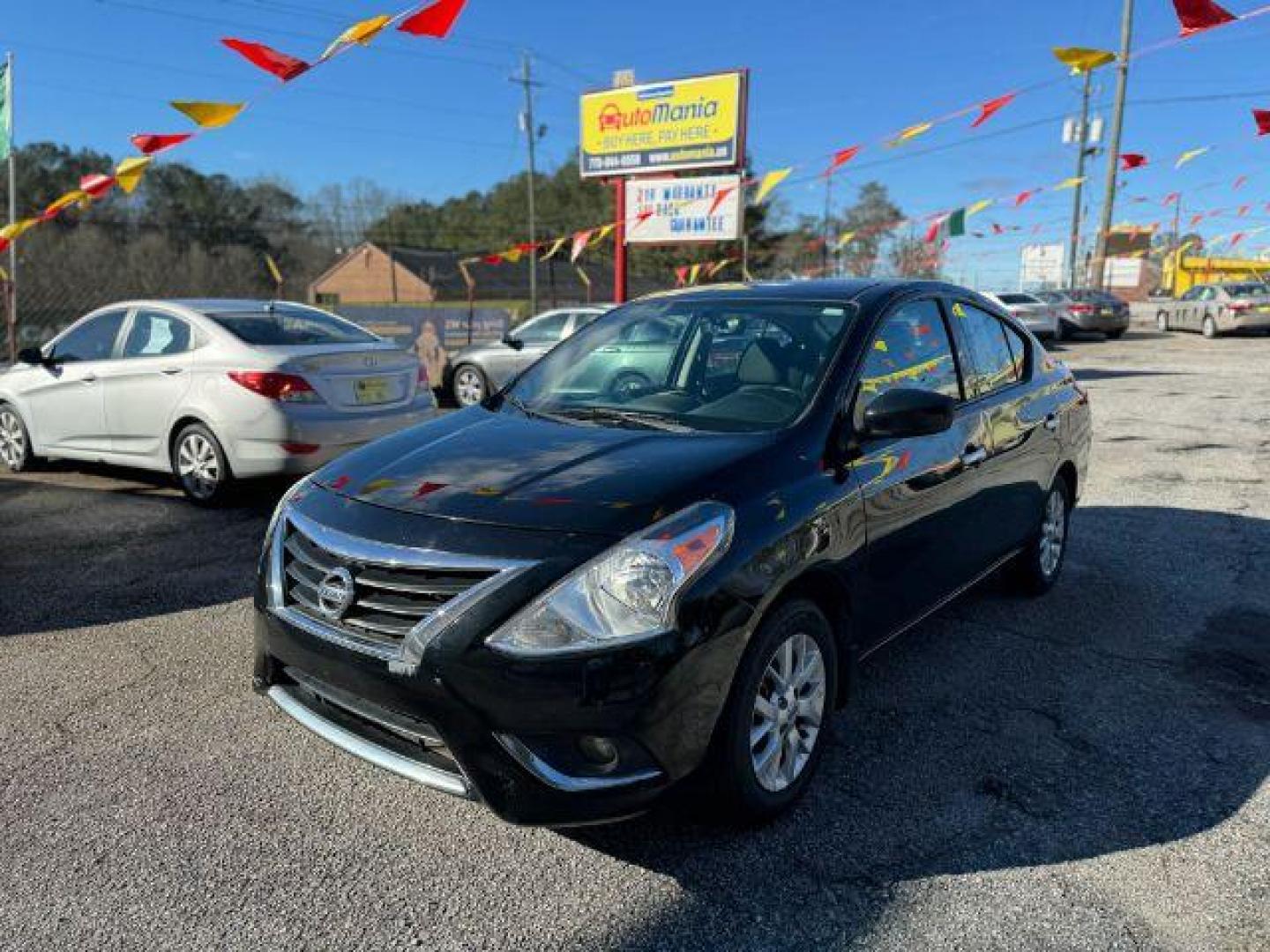 2018 Black Nissan Versa 1.6 SV Sedan (3N1CN7AP1JL) with an 1.6L L4 DOHC 16V engine, Continuously Variable Transmission transmission, located at 1806 Veterans Memorial Hwy SW, Austell, GA, 30168, (770) 944-9558, 33.817959, -84.606987 - Photo#0