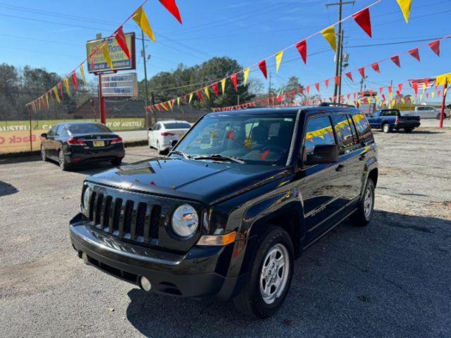 2015 Black Jeep Patriot Sport 2WD (1C4NJPBB7FD) with an 2.4L L4 DOHC 16V engine, located at 1806 Veterans Memorial Hwy SW, Austell, GA, 30168, (770) 944-9558, 33.817959, -84.606987 - Photo#0