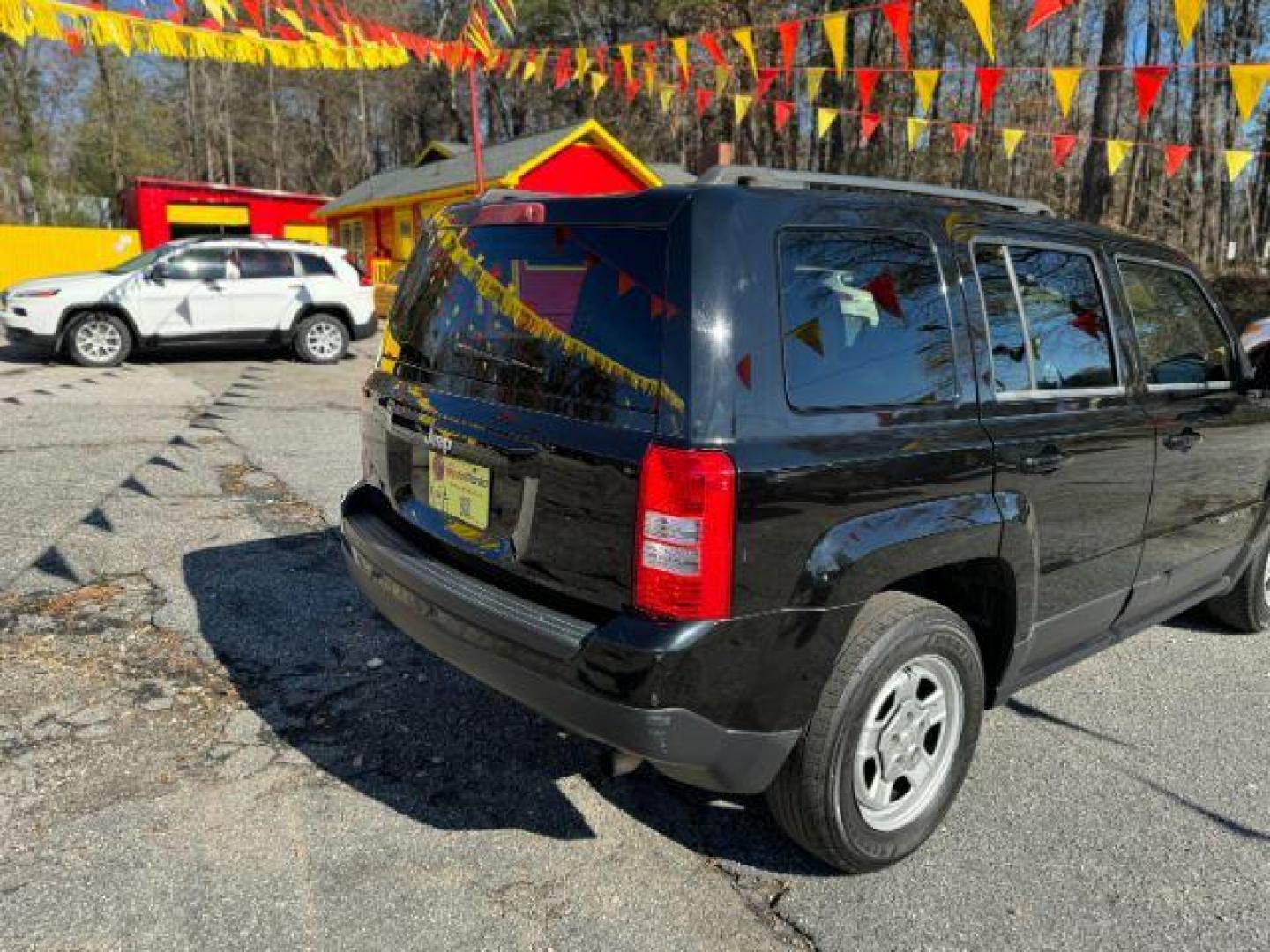 2015 Black Jeep Patriot Sport 2WD (1C4NJPBB7FD) with an 2.4L L4 DOHC 16V engine, located at 1806 Veterans Memorial Hwy SW, Austell, GA, 30168, (770) 944-9558, 33.817959, -84.606987 - Photo#2