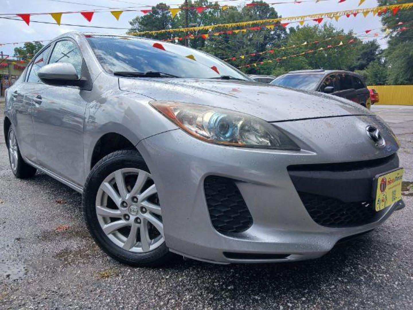 2012 Silver Mazda MAZDA3 i Touring 4-Door (JM1BL1V77C1) with an 2.0L L4 DOHC 16V engine, located at 1806 Veterans Memorial Hwy SW, Austell, GA, 30168, (770) 944-9558, 33.817959, -84.606987 - Photo#1