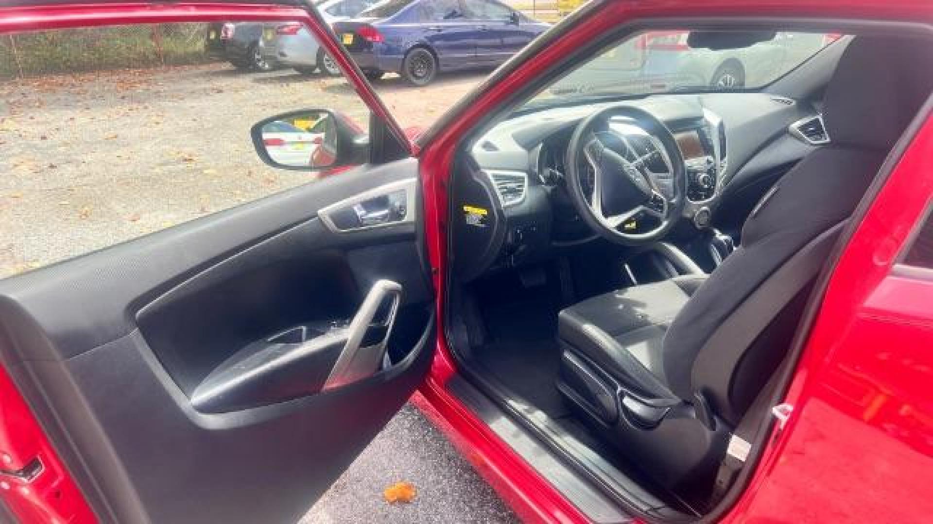 2013 Red Hyundai Veloster Base (KMHTC6ADXDU) with an 1.6L L4 DOHC 16V engine, 6-Speed Automatic transmission, located at 1806 Veterans Memorial Hwy SW, Austell, GA, 30168, (770) 944-9558, 33.817959, -84.606987 - Photo#9