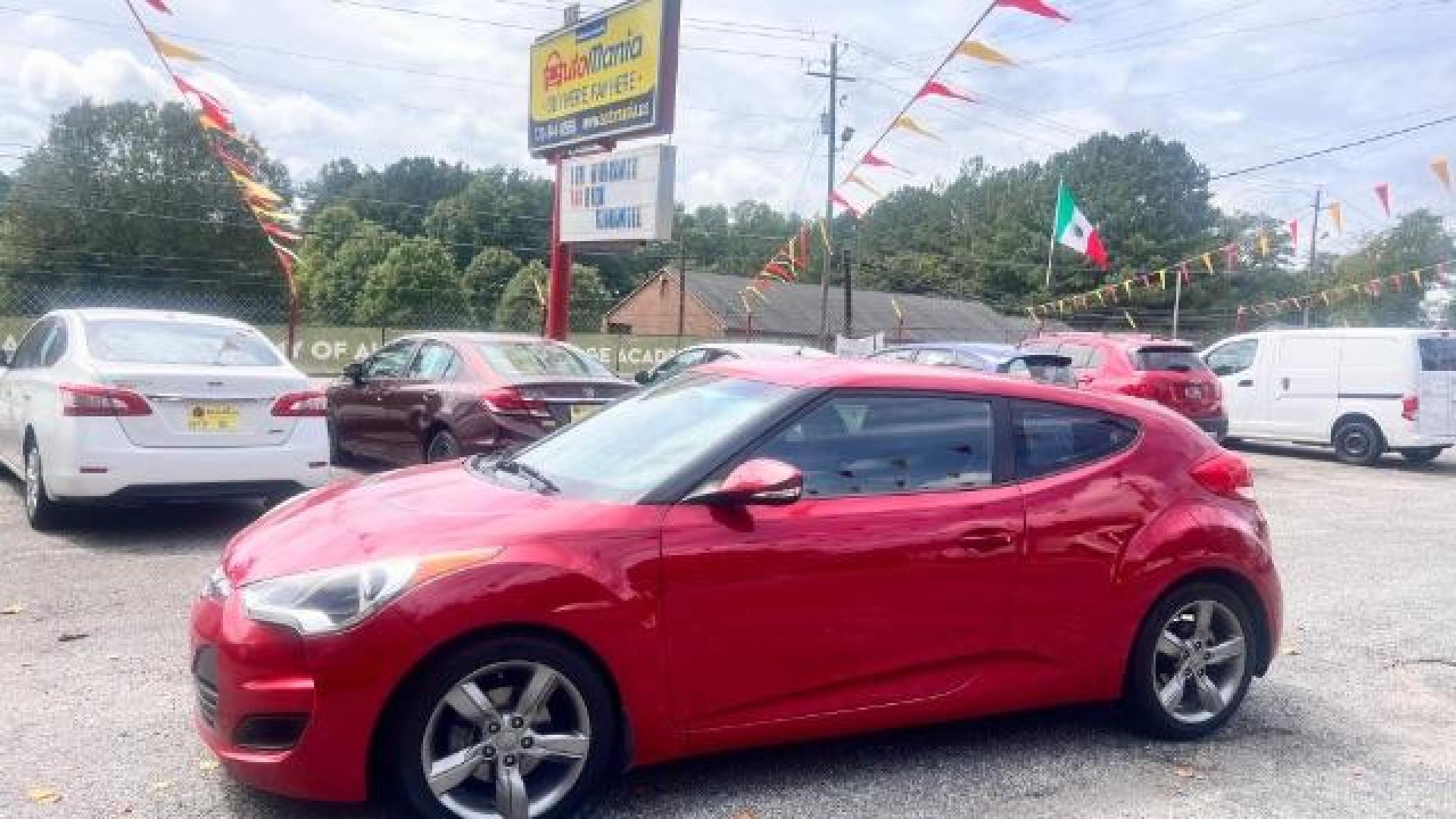 2013 Red Hyundai Veloster Base (KMHTC6ADXDU) with an 1.6L L4 DOHC 16V engine, 6-Speed Automatic transmission, located at 1806 Veterans Memorial Hwy SW, Austell, GA, 30168, (770) 944-9558, 33.817959, -84.606987 - Photo#2