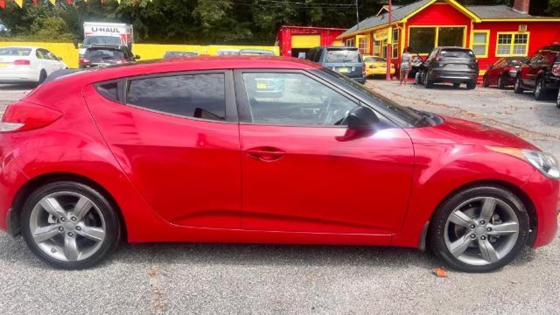 2013 Red Hyundai Veloster Base (KMHTC6ADXDU) with an 1.6L L4 DOHC 16V engine, 6-Speed Automatic transmission, located at 1806 Veterans Memorial Hwy SW, Austell, GA, 30168, (770) 944-9558, 33.817959, -84.606987 - Photo#3