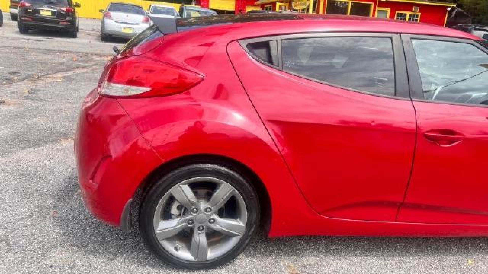 2013 Red Hyundai Veloster Base (KMHTC6ADXDU) with an 1.6L L4 DOHC 16V engine, 6-Speed Automatic transmission, located at 1806 Veterans Memorial Hwy SW, Austell, GA, 30168, (770) 944-9558, 33.817959, -84.606987 - Photo#5