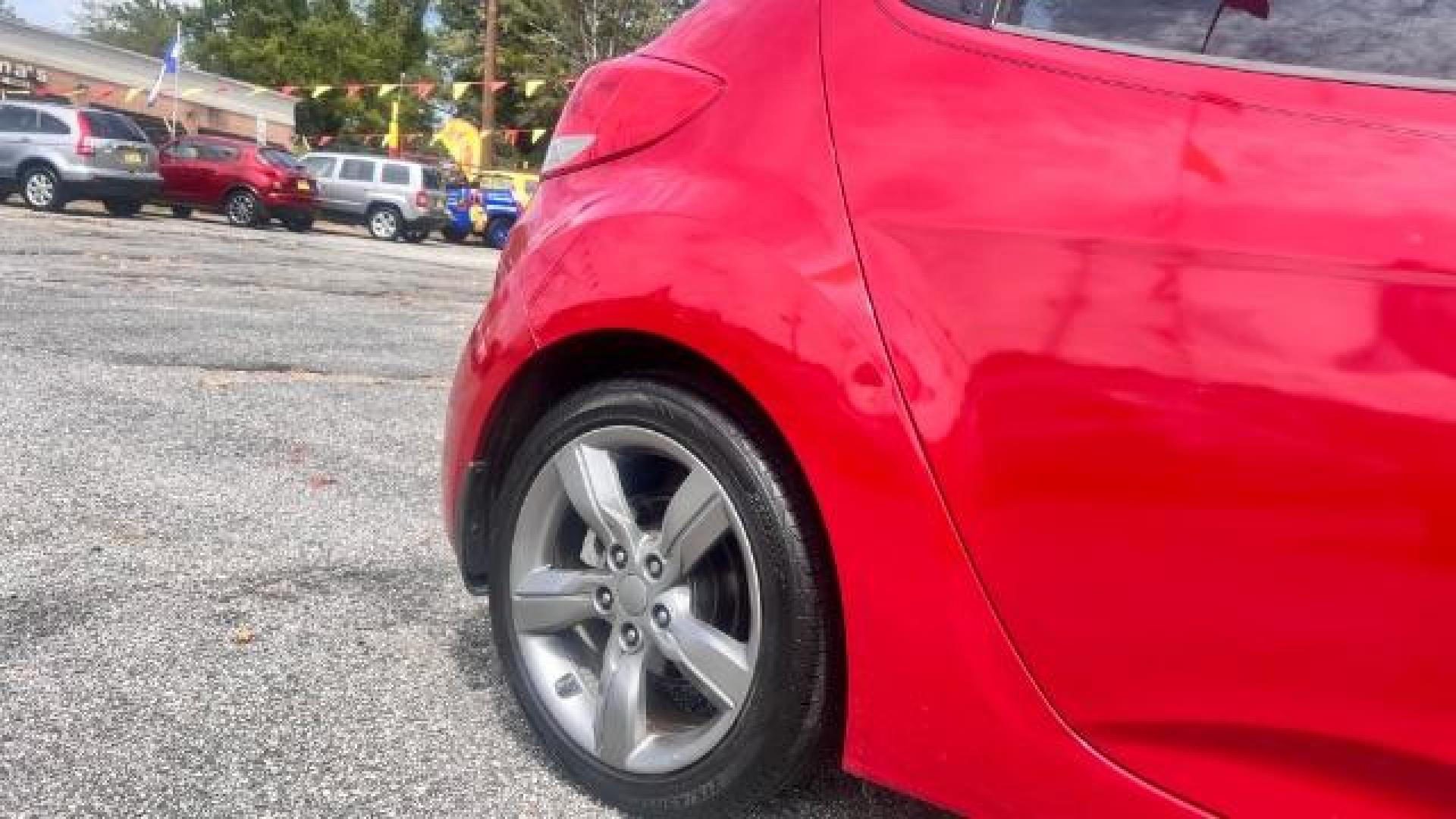 2013 Red Hyundai Veloster Base (KMHTC6ADXDU) with an 1.6L L4 DOHC 16V engine, 6-Speed Automatic transmission, located at 1806 Veterans Memorial Hwy SW, Austell, GA, 30168, (770) 944-9558, 33.817959, -84.606987 - Photo#6