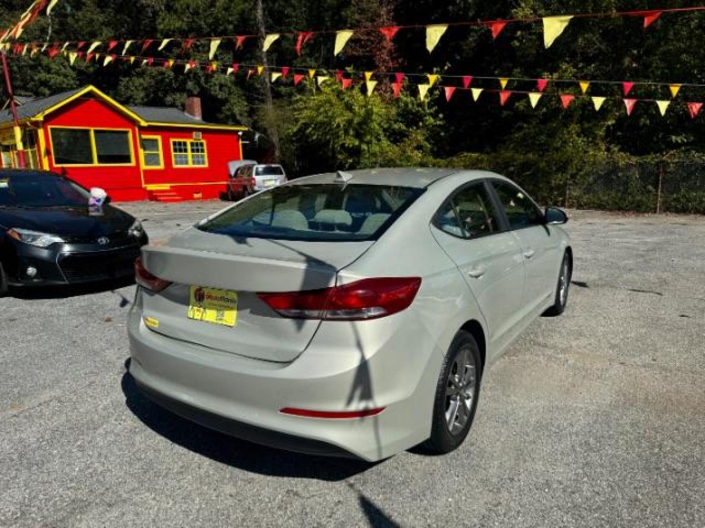 2017 Beige Hyundai Elantra Limited (KMHD84LF2HU) with an 1.8L L4 DOHC 16V engine, 6-Speed Automatic transmission, located at 1806 Veterans Memorial Hwy SW, Austell, GA, 30168, (770) 944-9558, 33.817959, -84.606987 - Photo#3