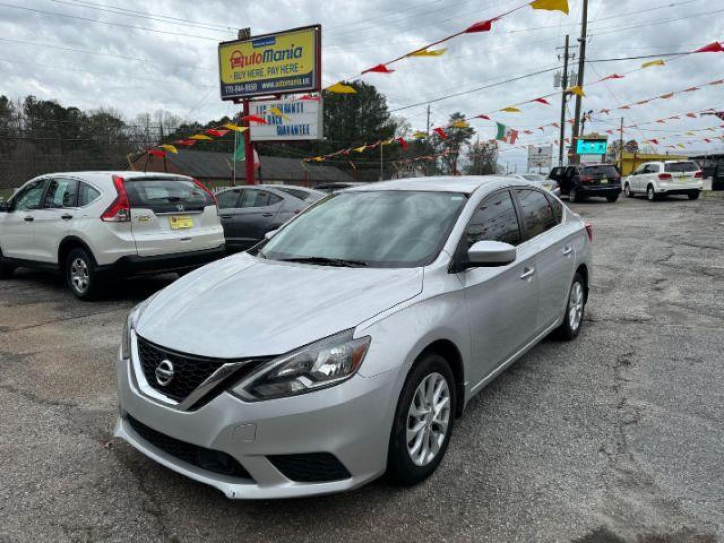 2018 Silver Nissan Sentra S CVT (3N1AB7AP0JL) with an 1.8L L4 SFI DOHC 16V engine, Continuously Variable Transmission transmission, located at 1806 Veterans Memorial Hwy SW, Austell, GA, 30168, (770) 944-9558, 33.817959, -84.606987 - Photo#0