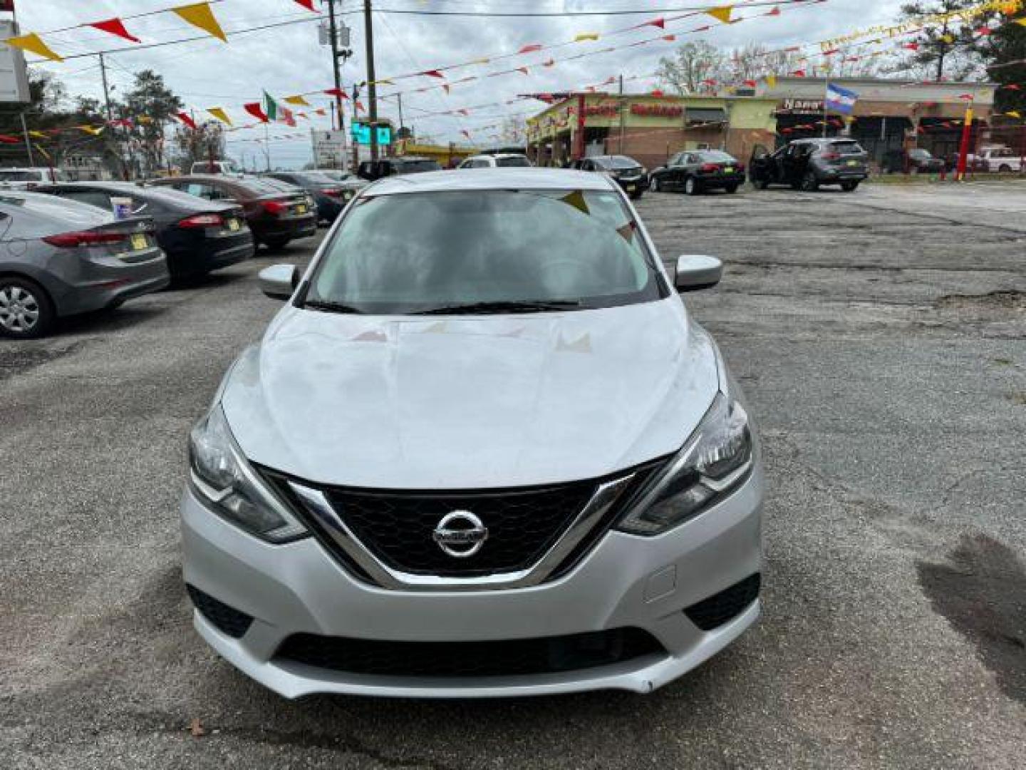 2018 Silver Nissan Sentra S CVT (3N1AB7AP0JL) with an 1.8L L4 SFI DOHC 16V engine, Continuously Variable Transmission transmission, located at 1806 Veterans Memorial Hwy SW, Austell, GA, 30168, (770) 944-9558, 33.817959, -84.606987 - Photo#0