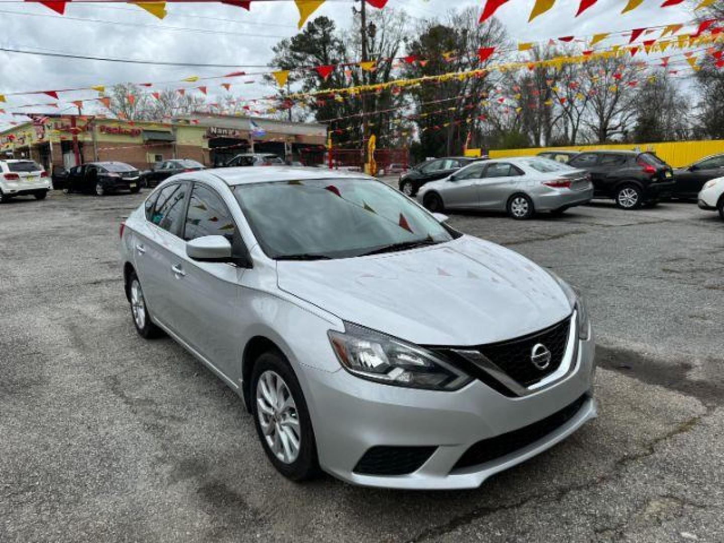 2018 Silver Nissan Sentra S CVT (3N1AB7AP0JL) with an 1.8L L4 SFI DOHC 16V engine, Continuously Variable Transmission transmission, located at 1806 Veterans Memorial Hwy SW, Austell, GA, 30168, (770) 944-9558, 33.817959, -84.606987 - Photo#2