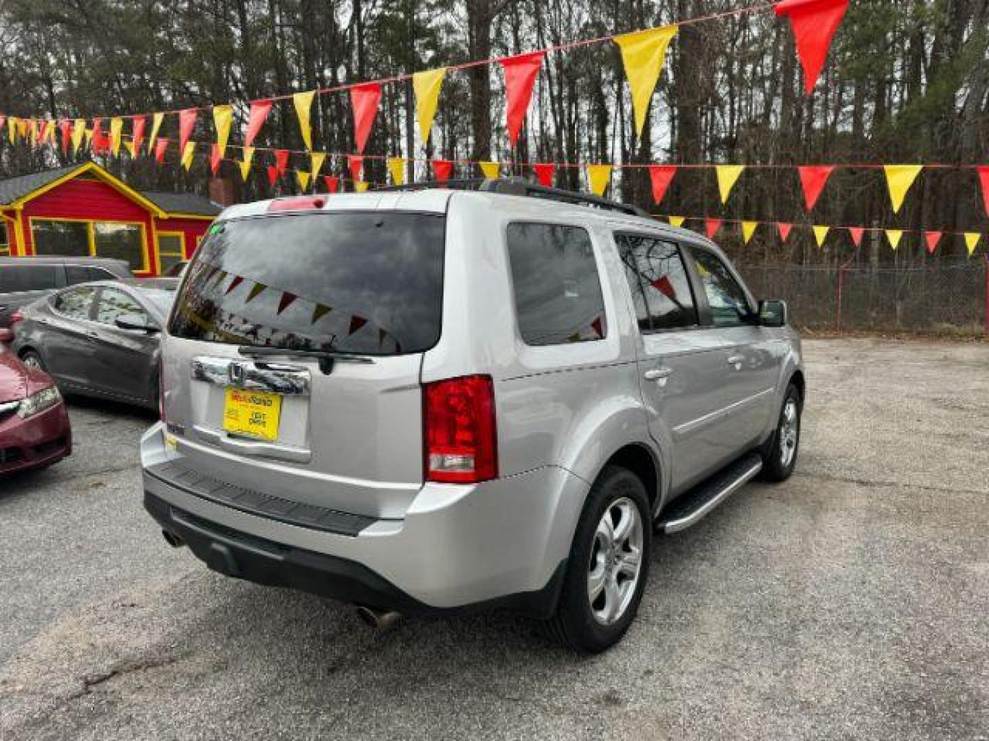 2014 Silver Honda Pilot EX-L 2WD 5-Spd AT with Navigation (5FNYF3H79EB) with an 3.5L V6 SOHC 24V engine, 5-Speed Automatic transmission, located at 1806 Veterans Memorial Hwy SW, Austell, GA, 30168, (770) 944-9558, 33.817959, -84.606987 - Photo#3