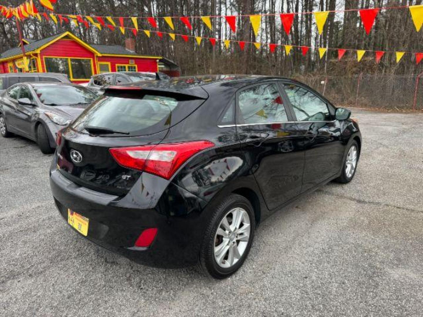 2013 Black Hyundai Elantra GT A/T (KMHD35LE3DU) with an 1.8L L4 16V DOHC engine, 6-Speed Automatic transmission, located at 1806 Veterans Memorial Hwy SW, Austell, GA, 30168, (770) 944-9558, 33.817959, -84.606987 - Photo#3